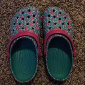 Women’s blue Crocs with floral pattern